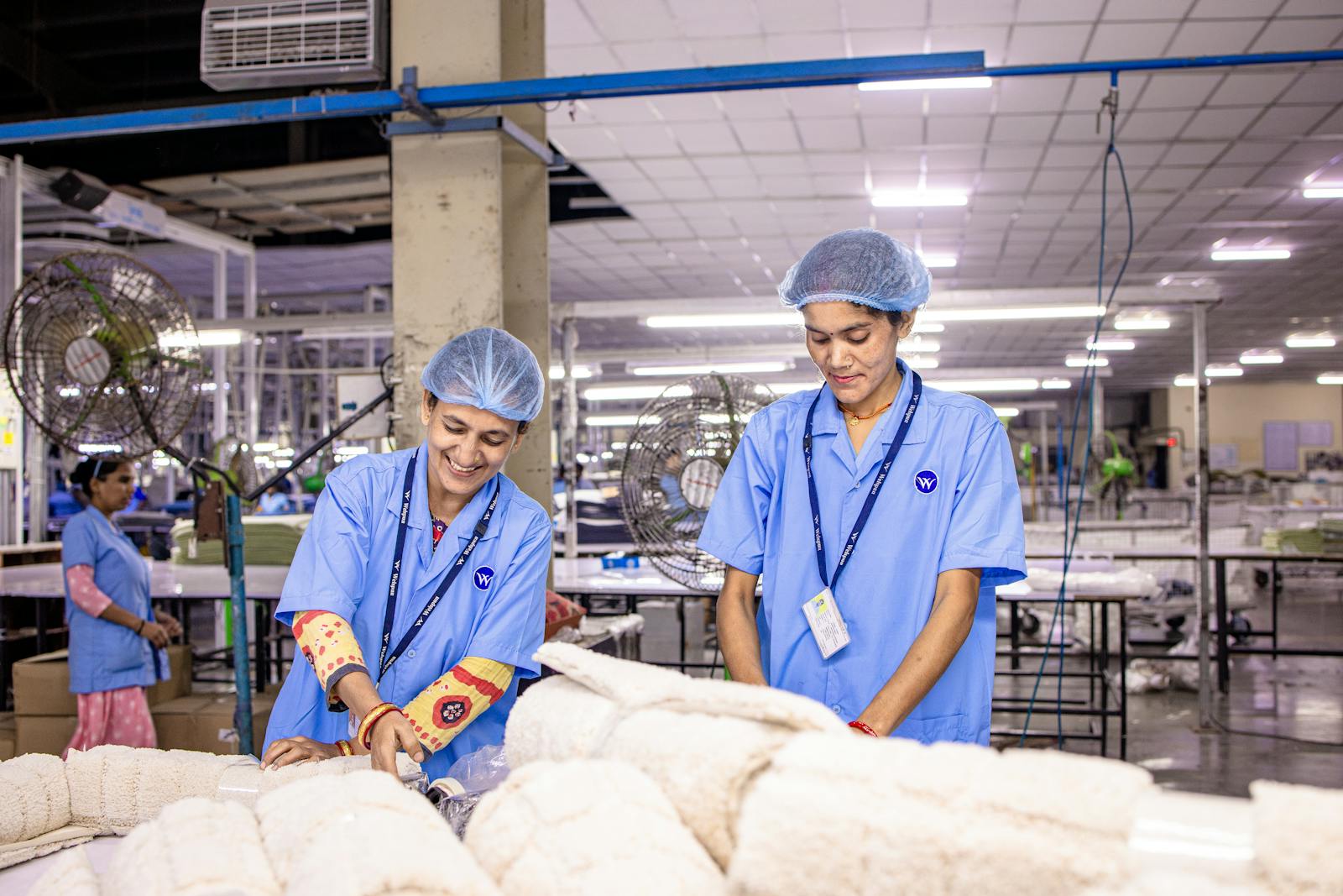 Indian factory workers on a manufacturing floor, the teams whose records support a paper bag supplier's technical claims