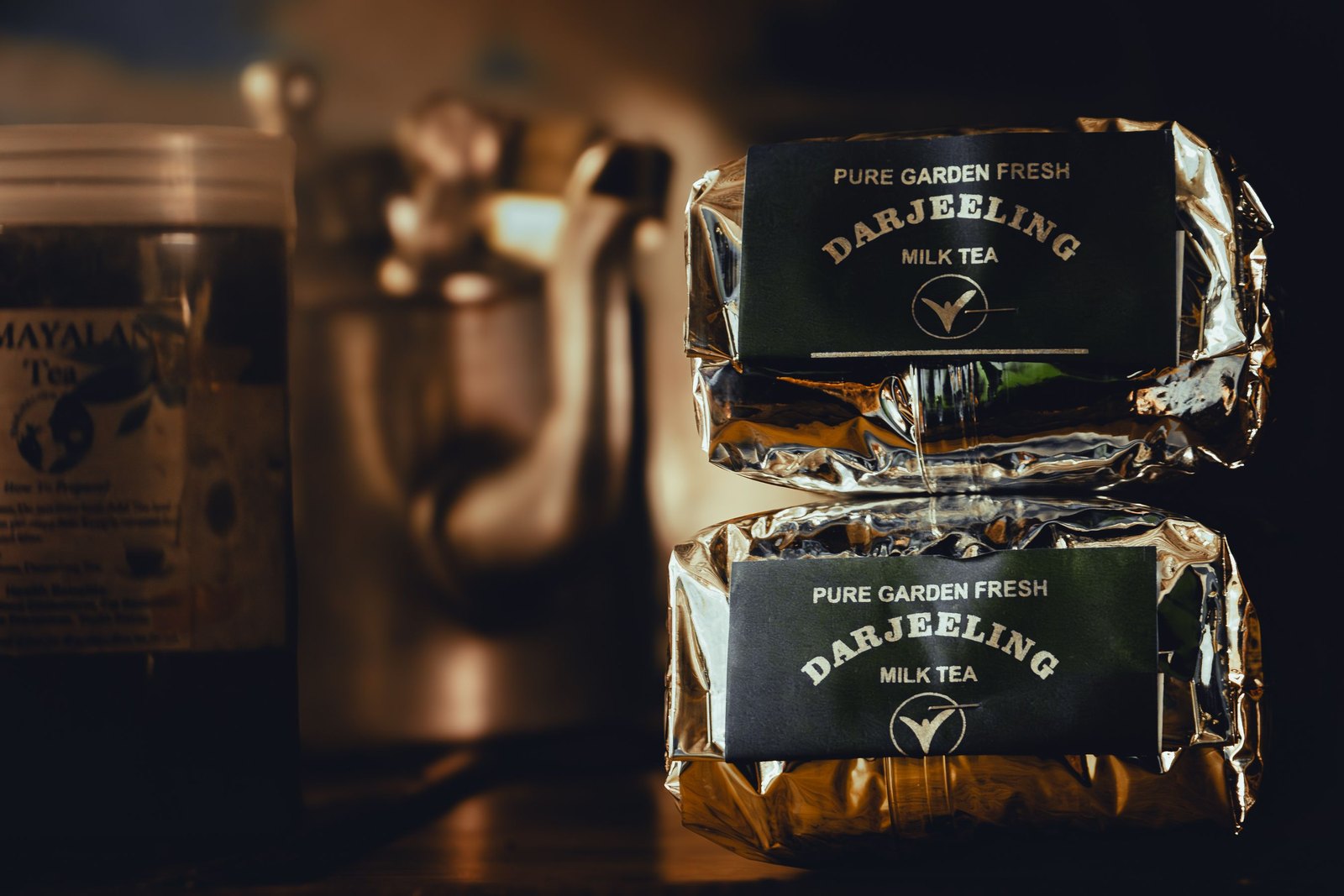 Darjeeling tea packs with metallic shimmer finish, showing retail tea pouch formats used by Indian tea brands