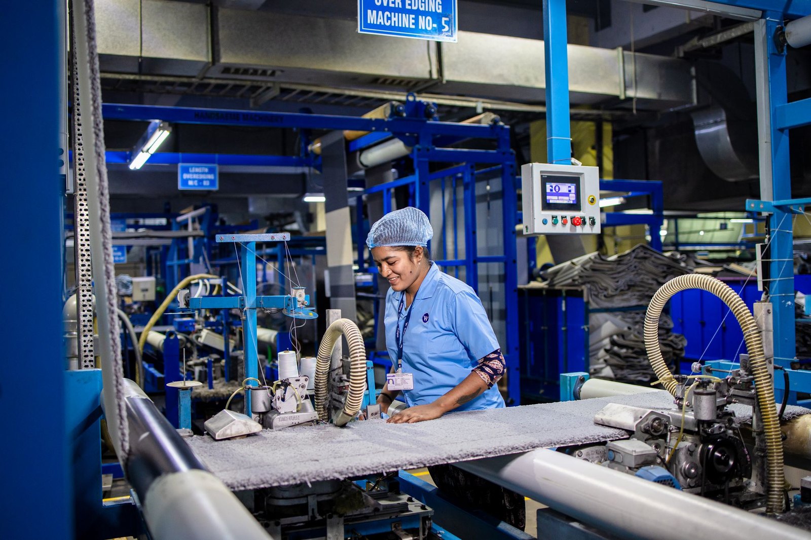 Operator running an industrial machine on an Indian factory floor, representing paper bag making machine and base paper compatibility