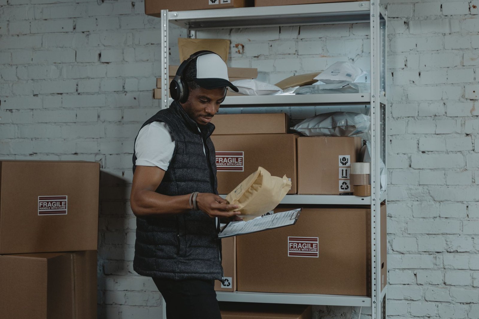 Warehouse worker sorting packaged goods for export dispatch
