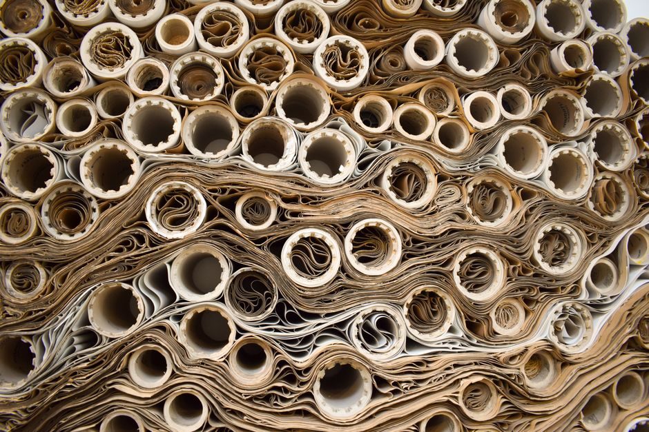 Close-up of stacked paper reels seen end-on, the reel stock specified for sachet paper converting